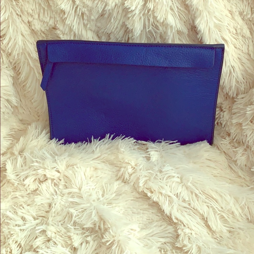 Royal blue leather clutch.